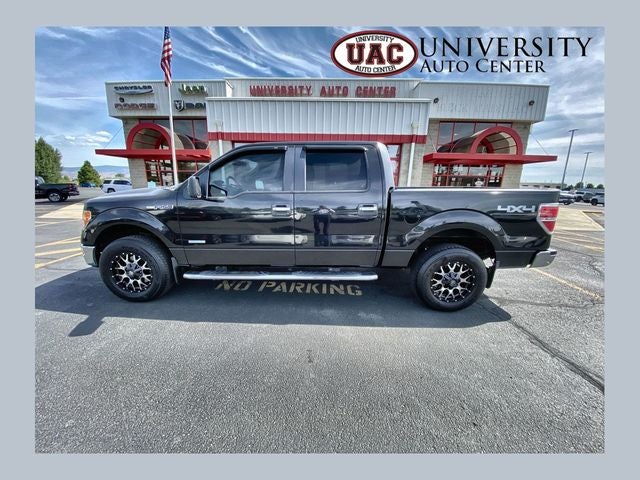 2014 Ford F-150 XLT in Tuxedo Black Metallic — front three-quarter view