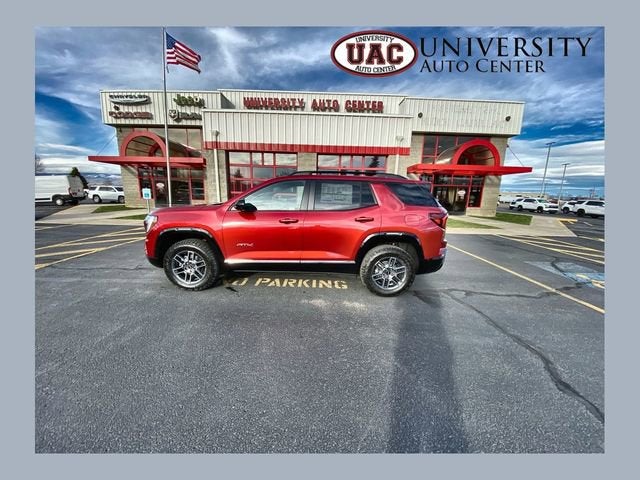 2026 GMC Terrain AT4 in Volcanic Red Tintcoat — front three-quarter view